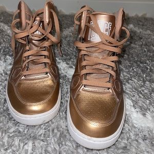 Son of Force metallic rose gold Nikes.